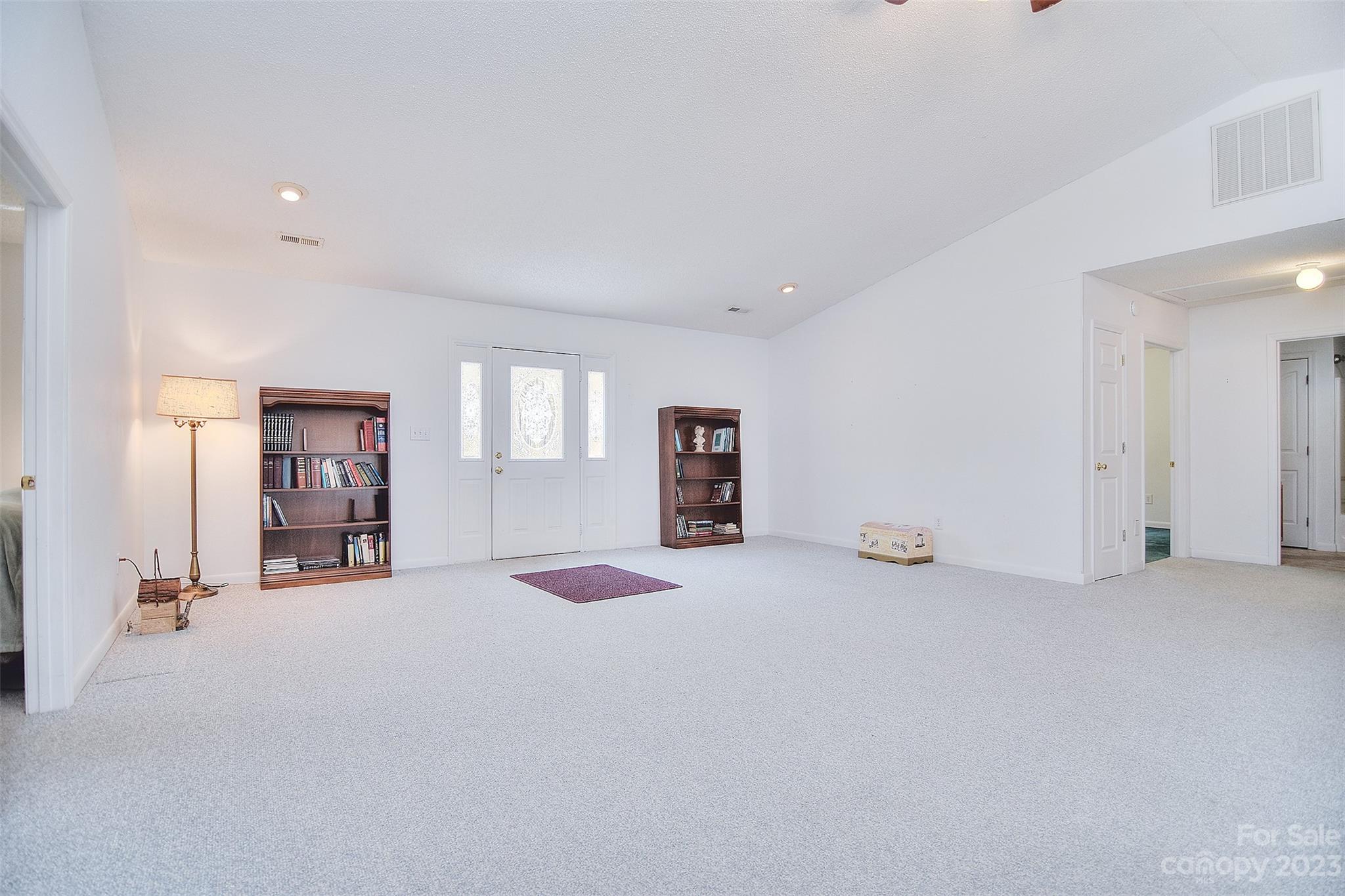8705 Simpson Road Waxhaw, NC 28173 - Photo 7 of 46 an empty room with a window and a mirror