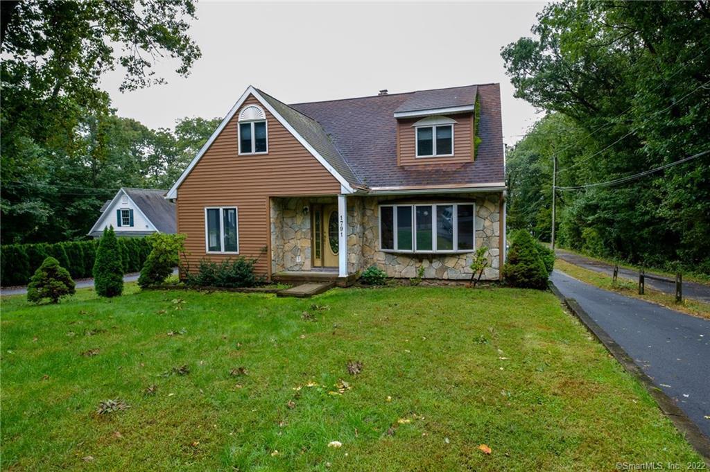 1791 Wolcott Road Wolcott, CT 06716 - Photo 1 of 1 a front view of a house with yard and green space