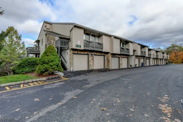 a view of a house with a street