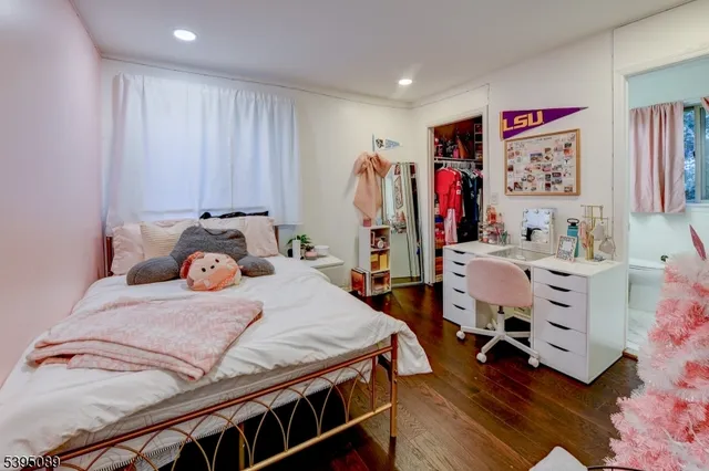 a bedroom with a bed and a walk in closet
