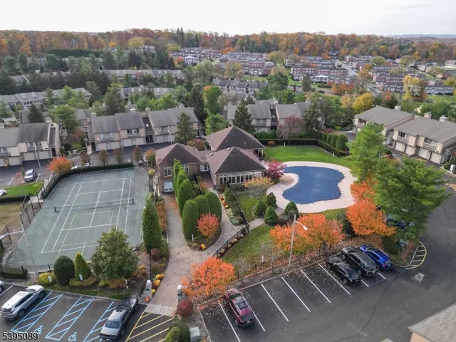 an aerial view of a house with yard swimming pool and outdoor seating