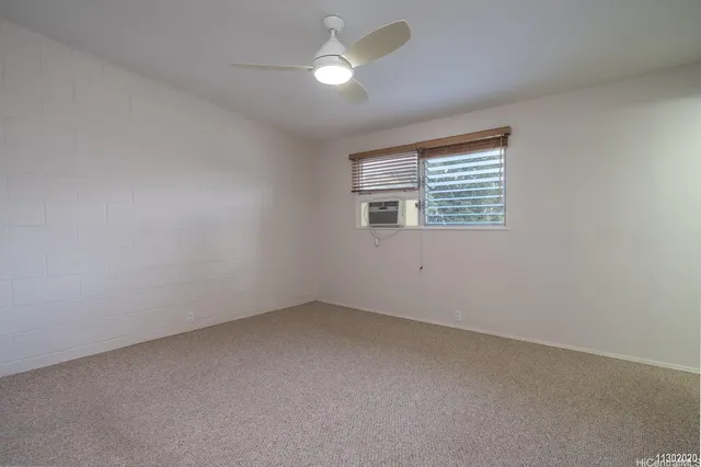 an empty room with closet area