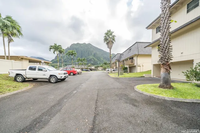 a view of a car parked in front of a house