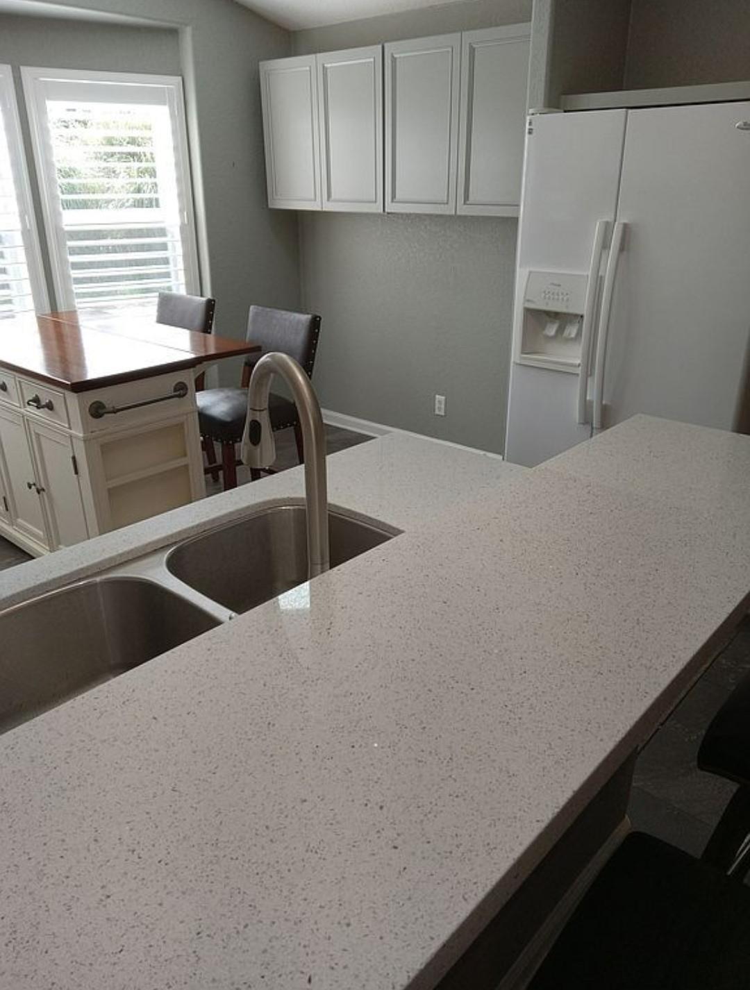 13955 West Walnut Grove Road, Unit 26 Walnut Grove, CA 95690 - Photo 11 of 31 a kitchen with a refrigerator and a sink