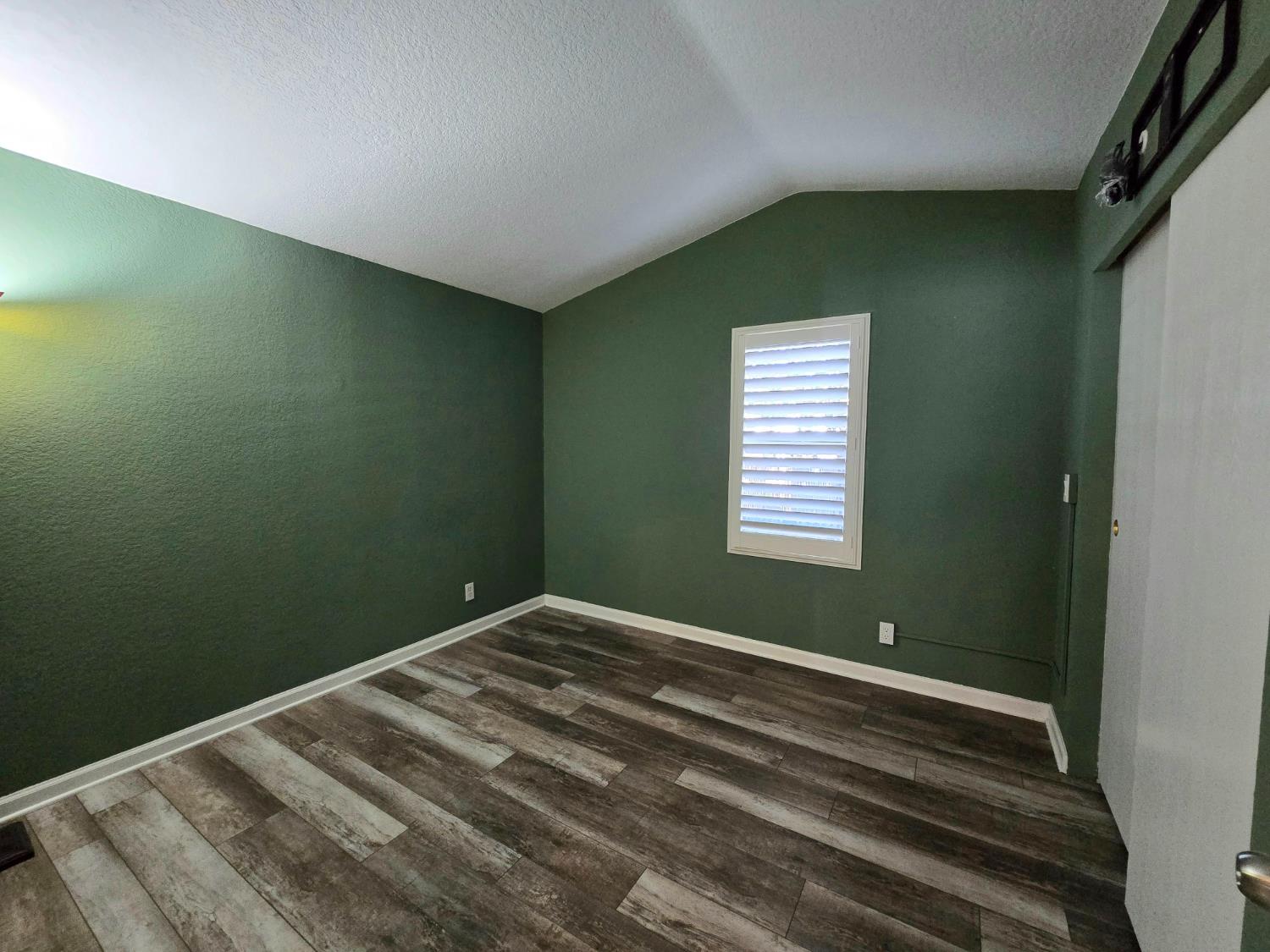 13955 West Walnut Grove Road, Unit 26 Walnut Grove, CA 95690 - Photo 18 of 31 a bedroom with a bed and a window