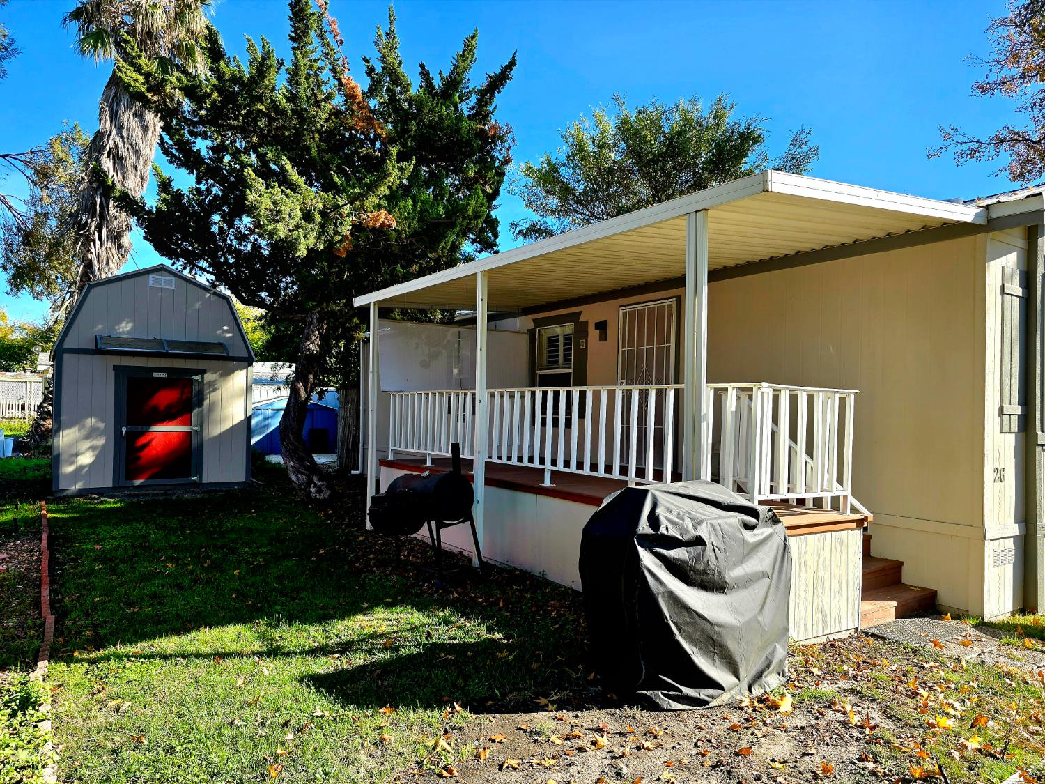 13955 West Walnut Grove Road, Unit 26 Walnut Grove, CA 95690 - Photo 3 of 31 a front view of a house with garden