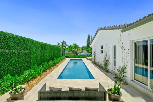 a view of swimming pool with a yard