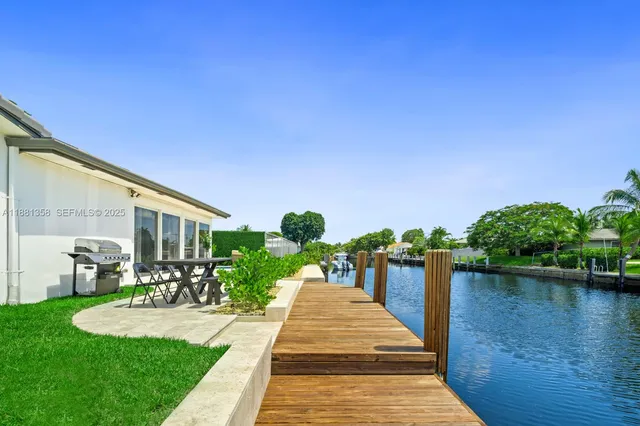 a view of a lake with a house in the background