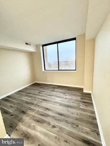 a view of an empty room with a window