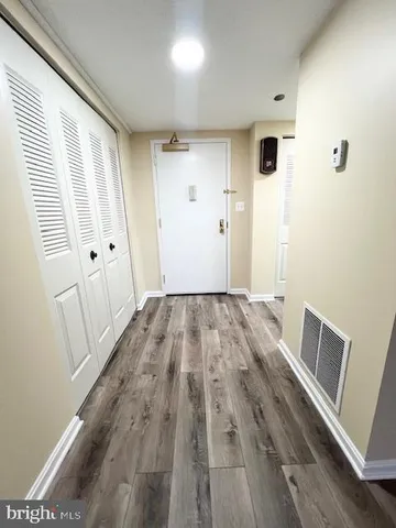 a view of a livingroom with wooden floor