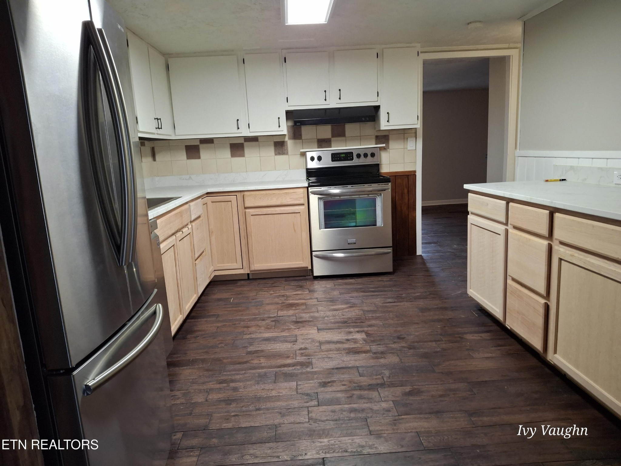 893 Brushy Valley Road Heiskell, TN 37754 - Photo 12 of 28 a kitchen with stainless steel appliances a stove sink and refrigerator