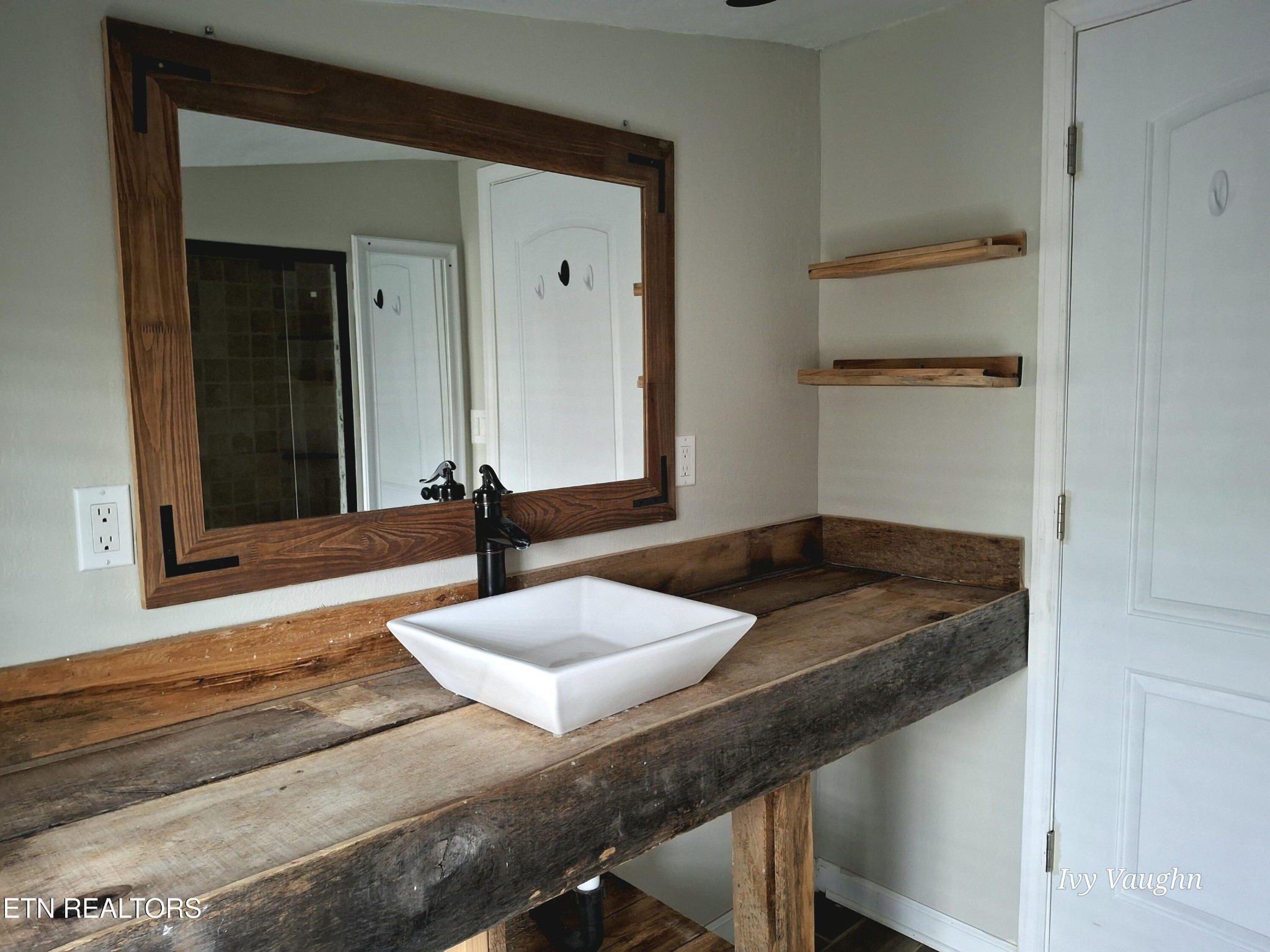 893 Brushy Valley Road Heiskell, TN 37754 - Photo 16 of 28 a bathroom with a granite countertop sink and a mirror