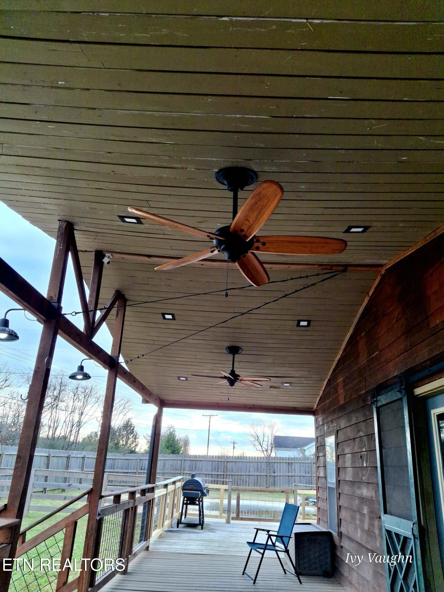 893 Brushy Valley Road Heiskell, TN 37754 - Photo 5 of 28 a view of a patio with table and chairs with wooden floor and fence