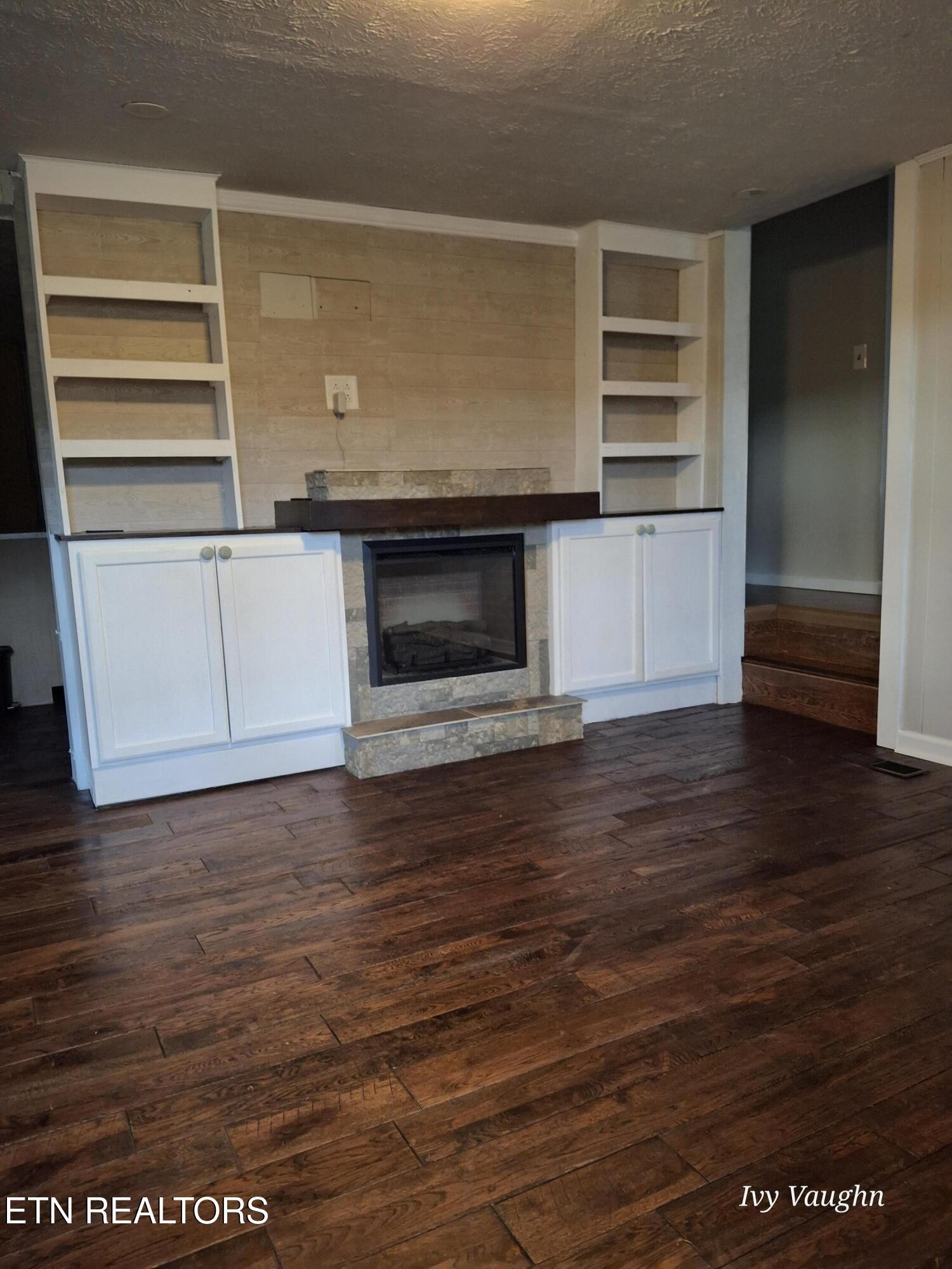 893 Brushy Valley Road Heiskell, TN 37754 - Photo 9 of 28 a view of kitchen and empty room with wooden floor