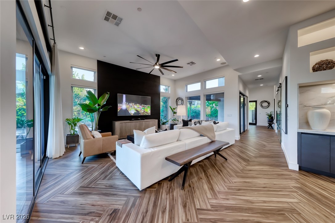 2216 Sky Pointe Ridge Drive Henderson, NV 89052 - Photo 12 of 79 The decorative wall for the TV adds warmth to the room