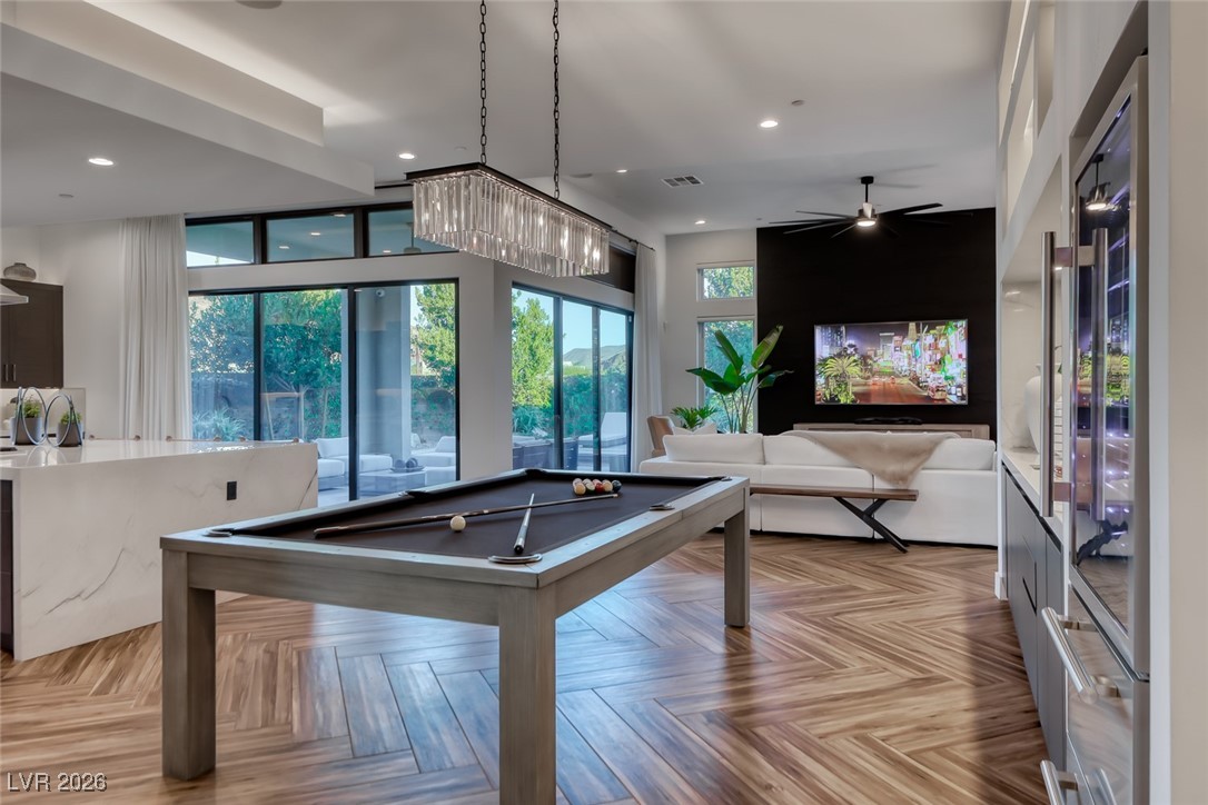 2216 Sky Pointe Ridge Drive Henderson, NV 89052 - Photo 14 of 79 This area can be used as a dining area or for additional entertainment space ( like the pool table in the photo)