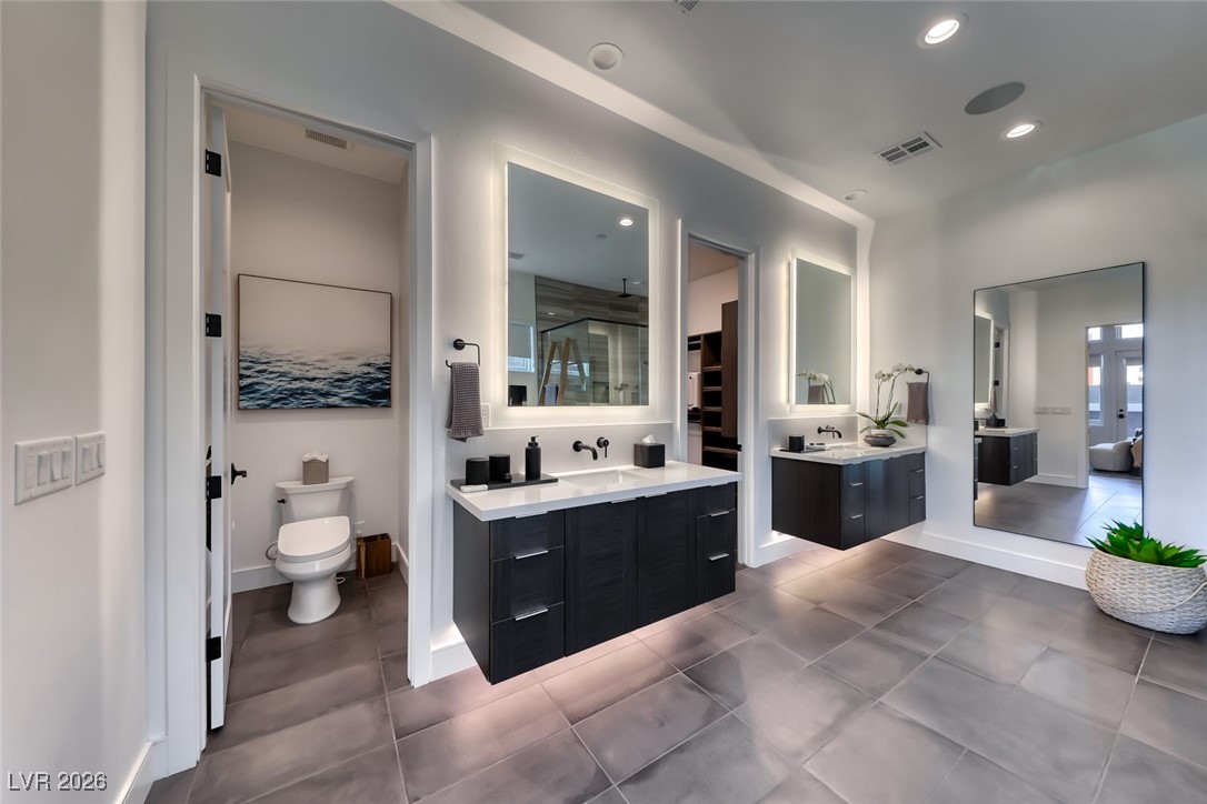 2216 Sky Pointe Ridge Drive Henderson, NV 89052 - Photo 34 of 79 Separate vanities with enhanced lighting features and upgraded Toto toilet