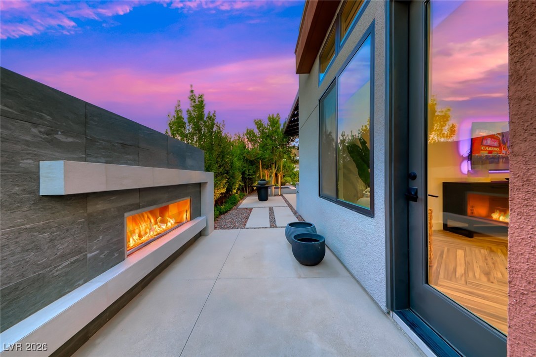 2216 Sky Pointe Ridge Drive Henderson, NV 89052 - Photo 49 of 79 Freestanding Fireplace off the Primary Suite