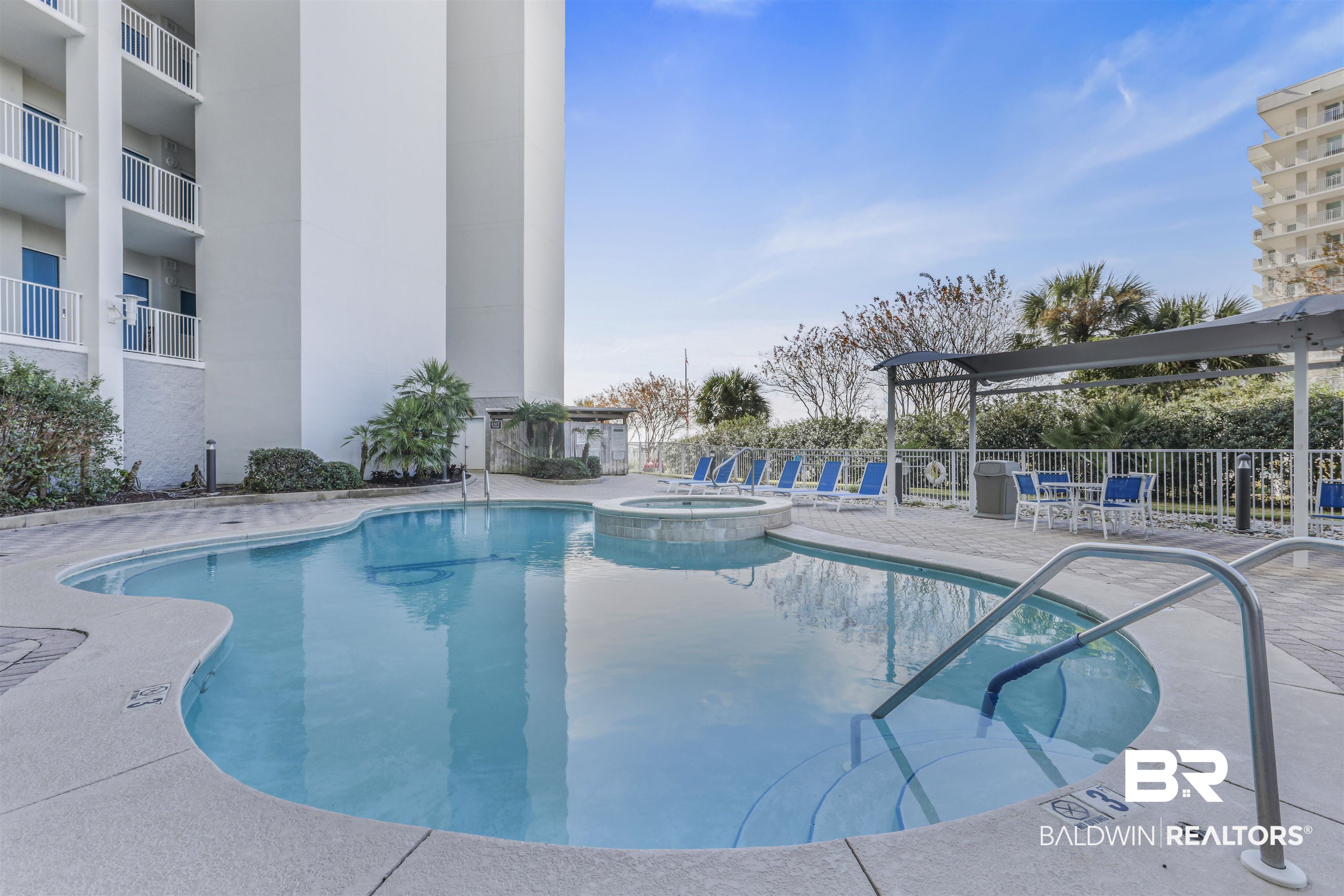 28250 Canal Road, Unit 106 Orange Beach, AL 36561 - Photo 36 of 50 View of pool featuring a patio area, a pool with connected hot tub, and a pergola