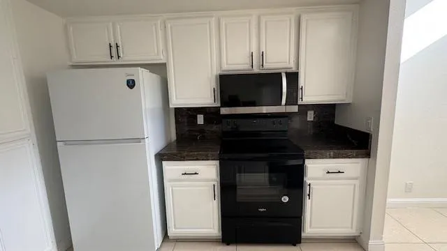 a utility room with washer and dryer