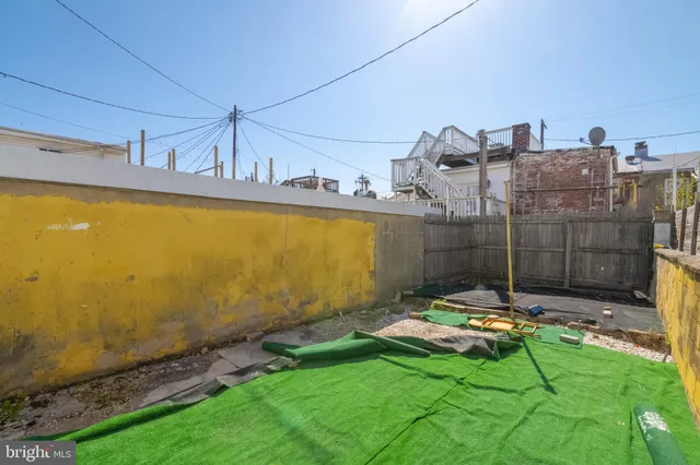 a view of swimming pool with a yard
