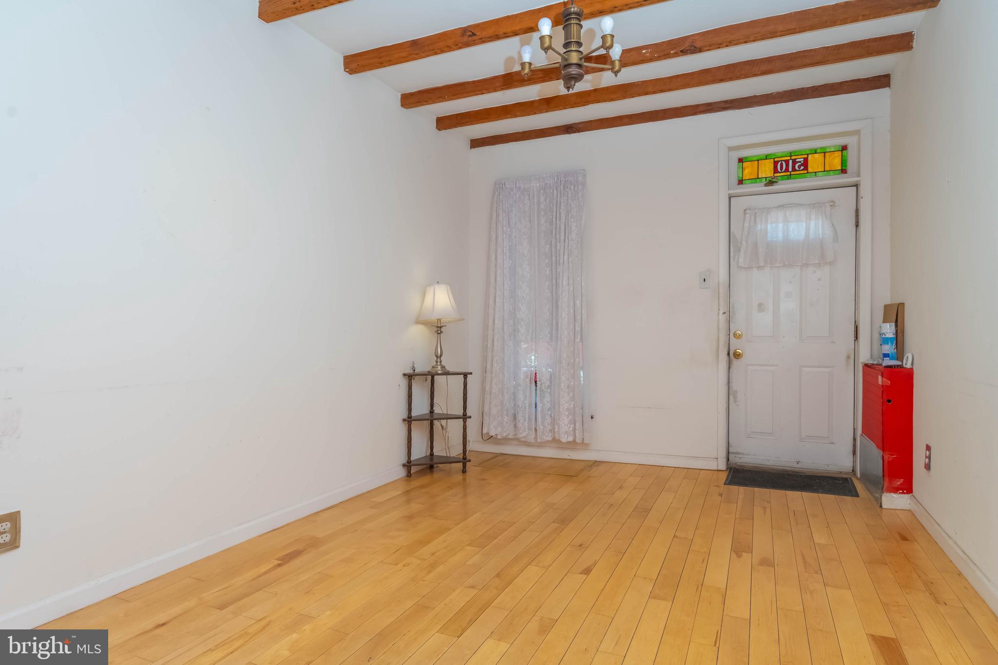 510 South Patterson Park Avenue Baltimore, MD 21231 - Photo 3 of 41 a view of empty room with wooden floor
