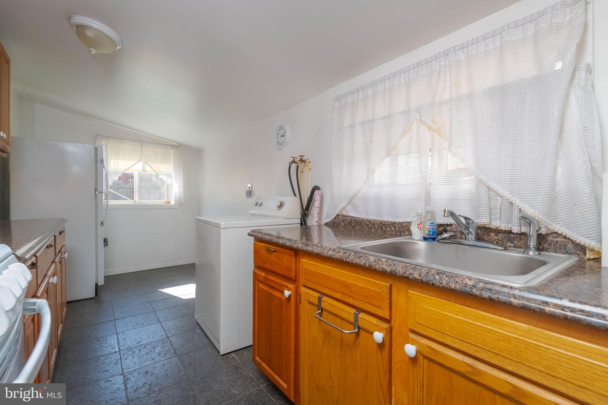 510 South Patterson Park Avenue Baltimore, MD 21231 - Photo 8 of 41 a kitchen with sink and window