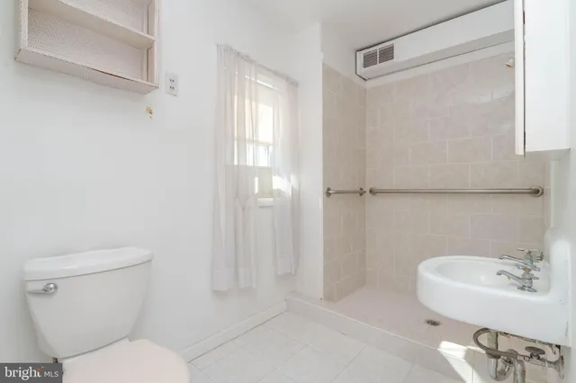 a bathroom with a toilet and a sink