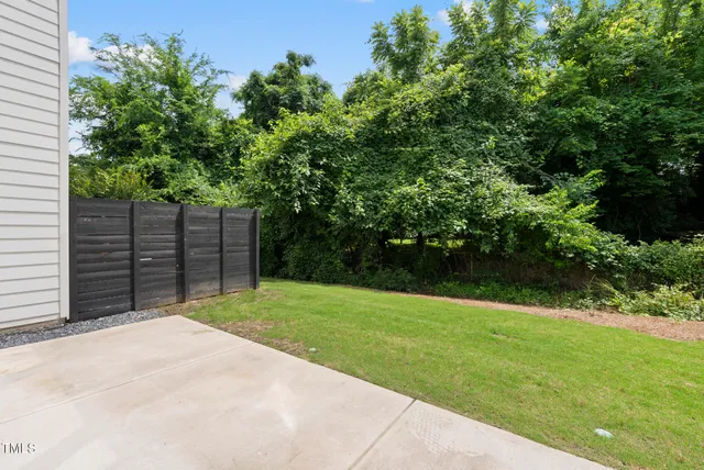a view of a backyard with a trees