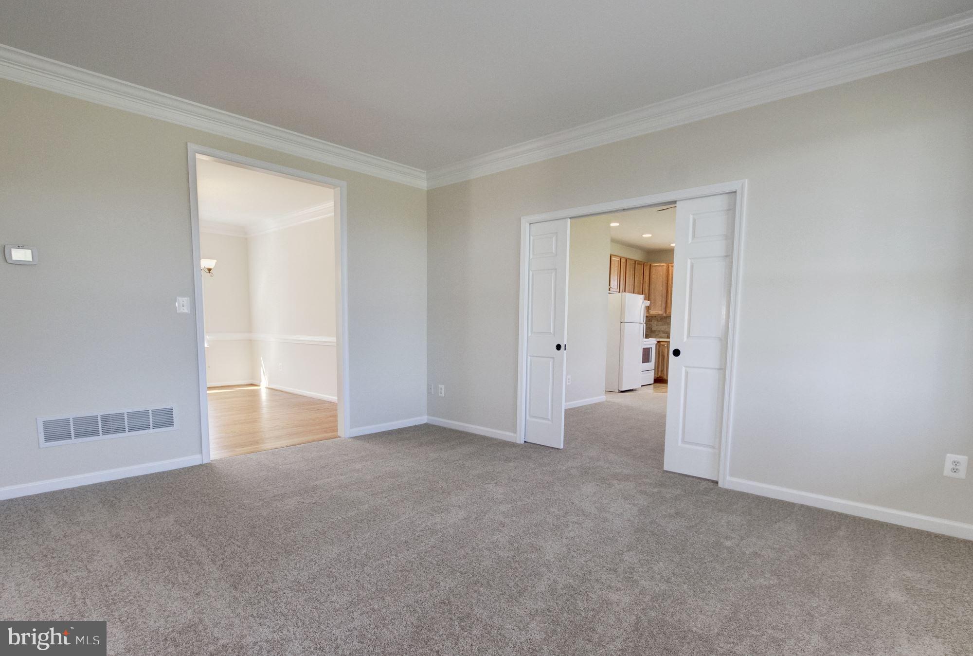 689 West Watersville Road Mount Airy, MD 21771 - Photo 17 of 50 FORMAL LIVING ROOM WITH POCKET DOORS TO ADDITION