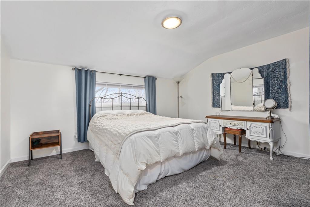 333 Frazier Drive Pittsburgh, PA 15235 - Photo 12 of 22 a bedroom with a bed and a table