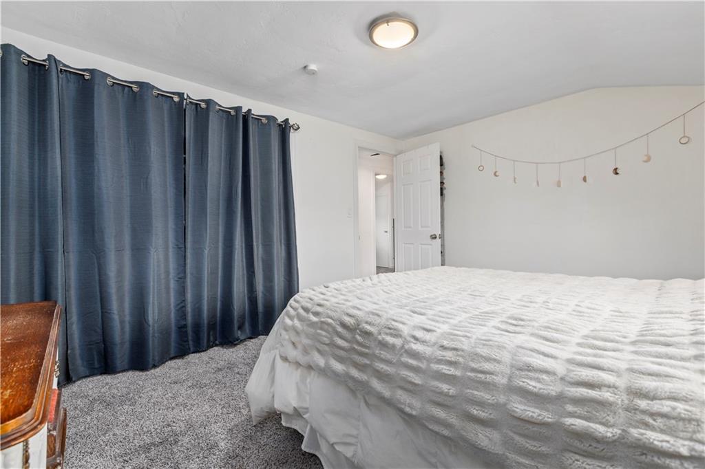 333 Frazier Drive Pittsburgh, PA 15235 - Photo 13 of 22 a bedroom with a bed and a chair