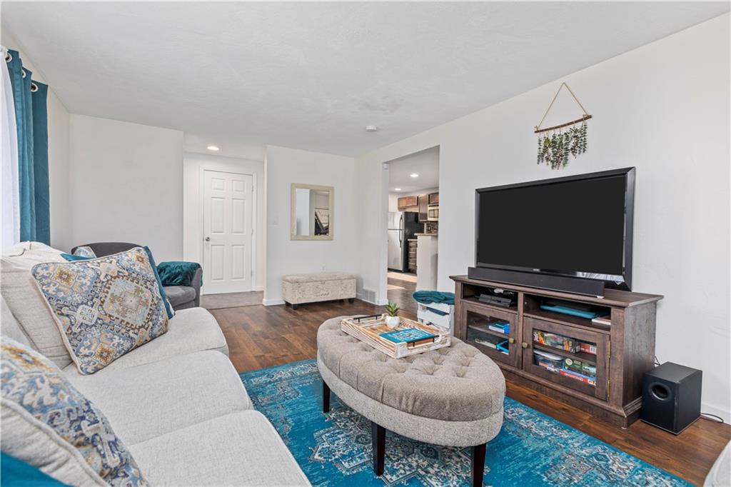 333 Frazier Drive Pittsburgh, PA 15235 - Photo 5 of 22 a living room with furniture and a flat screen tv