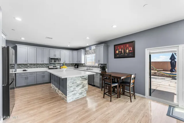 a kitchen with a table and chairs in it