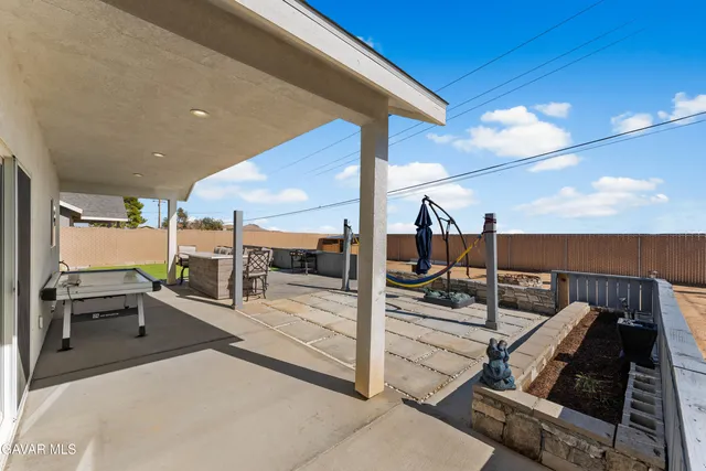 an aerial view of a house with outdoor space