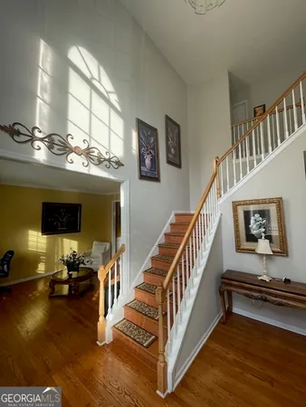 a view of hall way with furniture