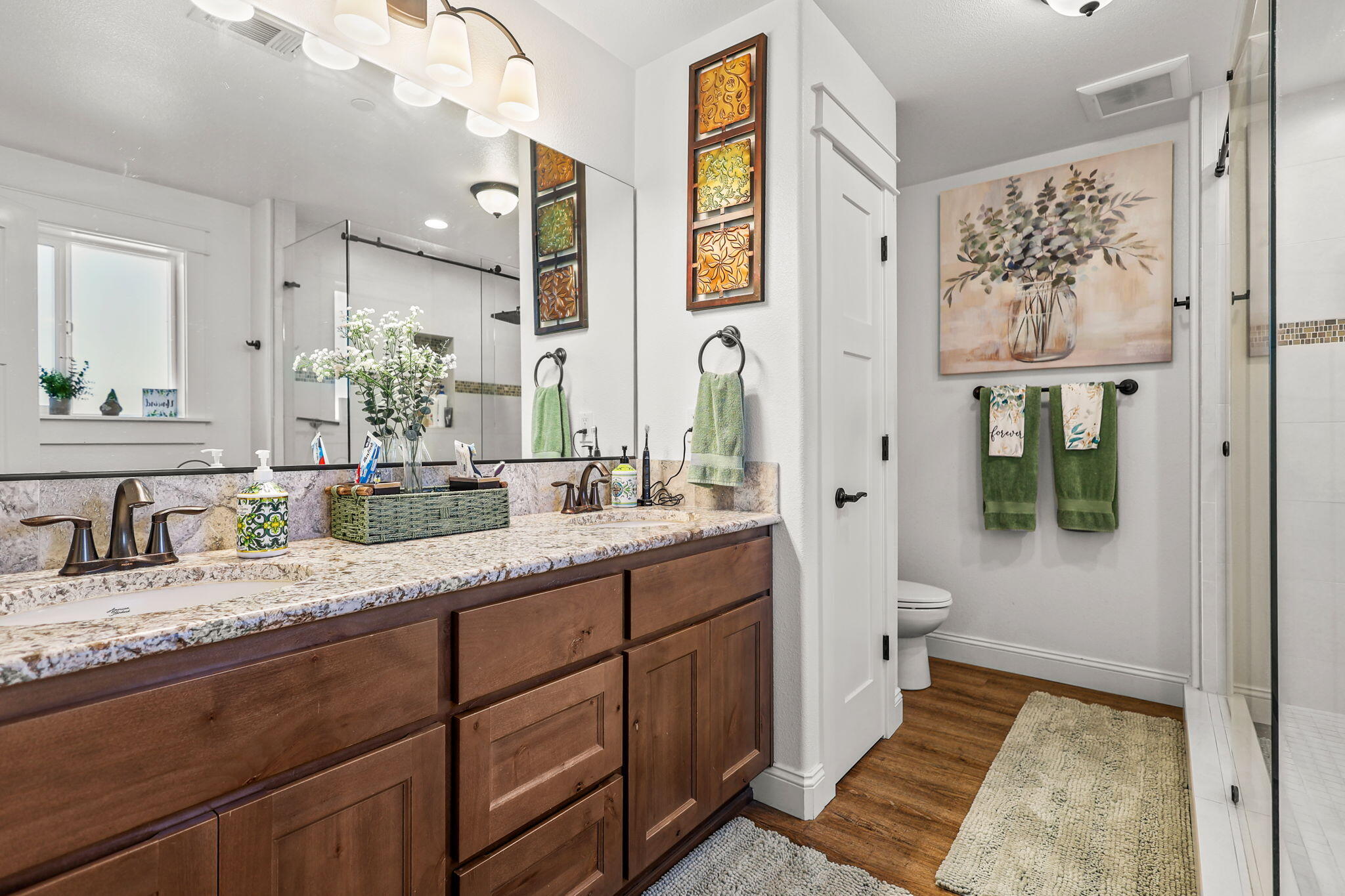5511 Wilson Hill Road Manton, CA 96059 - Photo 20 of 71 a bathroom with a granite countertop sink mirror vanity and a toilet