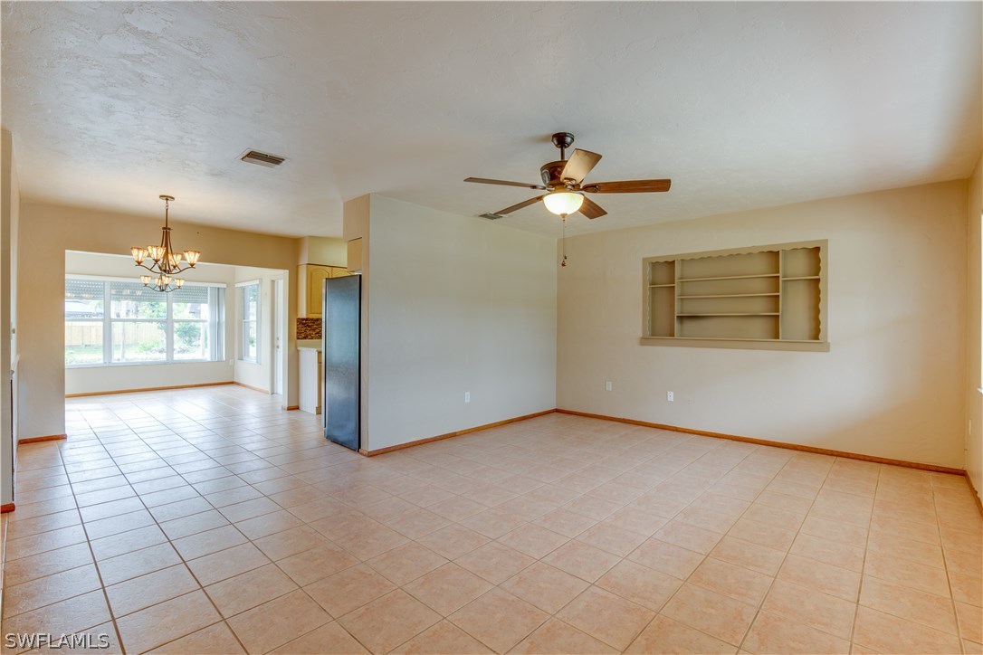 1418 Charles Road Fort Myers, FL 33919 - Photo 3 of 24 a view of an empty room with a window
