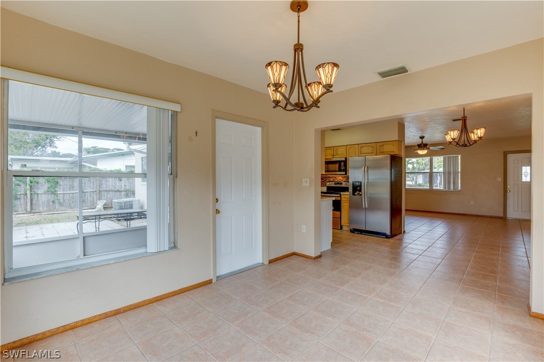 1418 Charles Road Fort Myers, FL 33919 - Photo 8 of 24 a view of a kitchen with a sink stainless steel appliances and cabinets