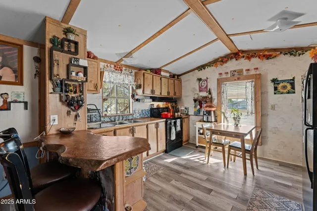 a view of a dining room with furniture and a chandelier