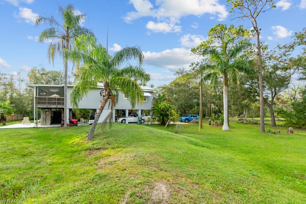 39200 Cook Brown Road Punta Gorda, FL 33982 - Photo 1 of 1 a view of a park with large trees