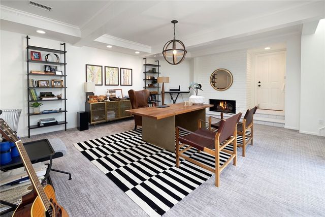 a view of a patio with table and chairs and potted plants