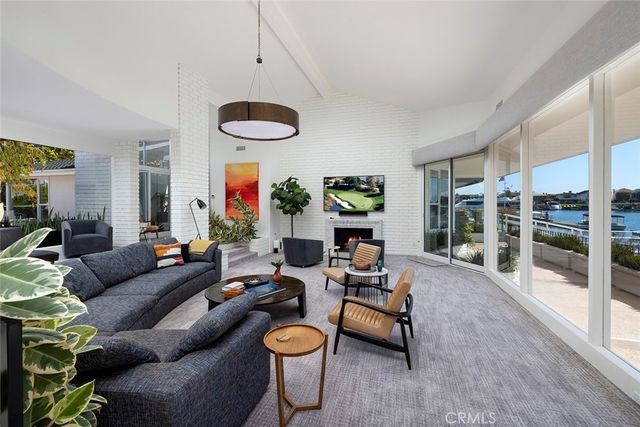 a kitchen with stainless steel appliances granite countertop a kitchen island a stove a table and chairs in it