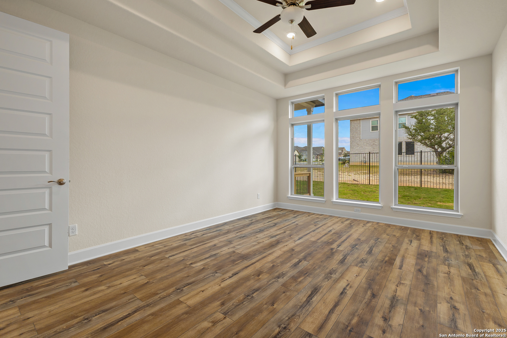 1716 Durham Bulverde, TX 78163 - Photo 15 of 42 a view of an empty room with a window and wooden floor