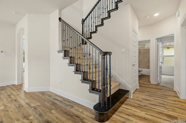 a view of an empty room with stairs