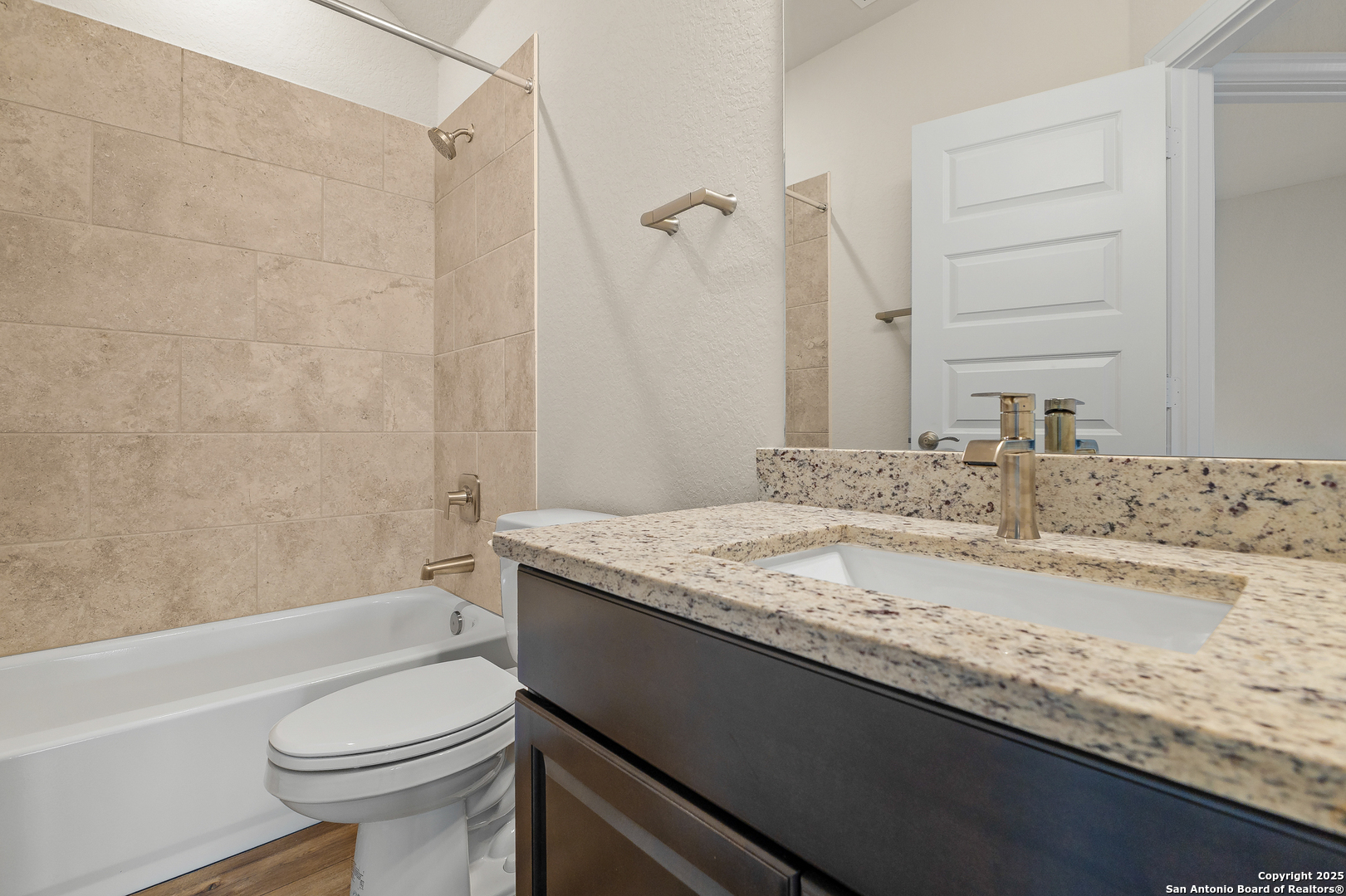 1716 Durham Bulverde, TX 78163 - Photo 29 of 42 a bathroom with a granite countertop sink toilet and shower