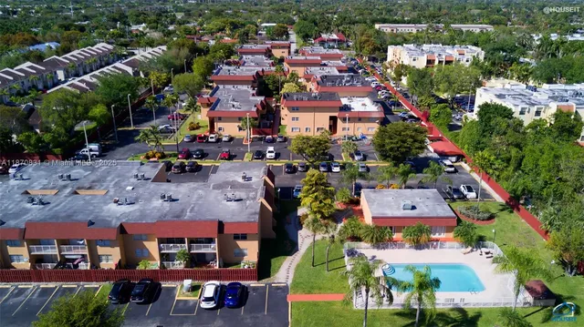 an aerial view of multiple houses with yard