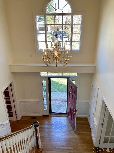 13019 Chipstead Road Chester, VA 23831 - Photo 2 of 23 a view of a hallway with wooden floor and staircase