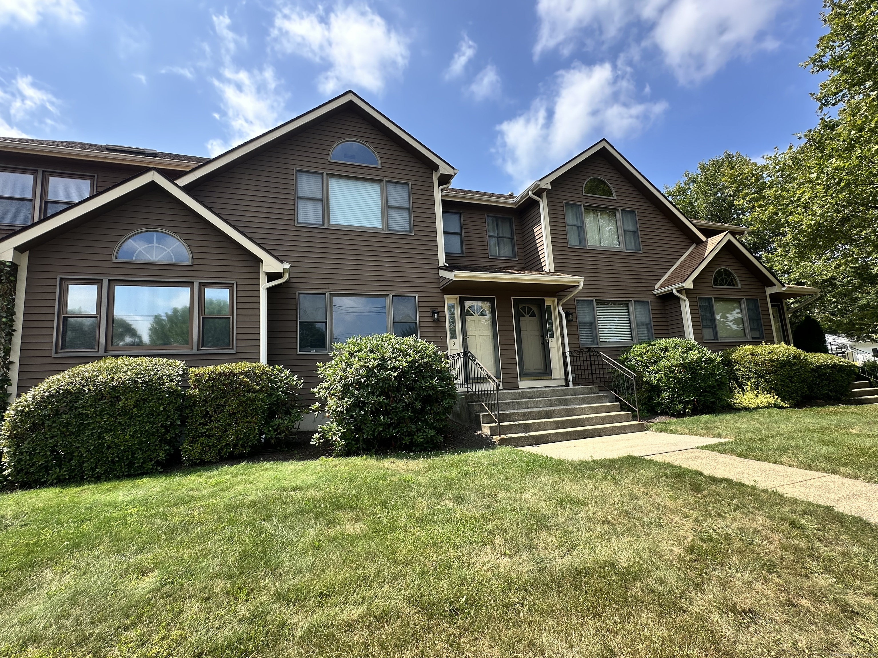 366 Ash Street, Unit 2 Windham, CT 06226 - Photo 1 of 1 a front view of a house with a yard