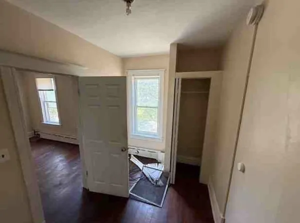 a kitchen with a stove a refrigerator and a stove top oven